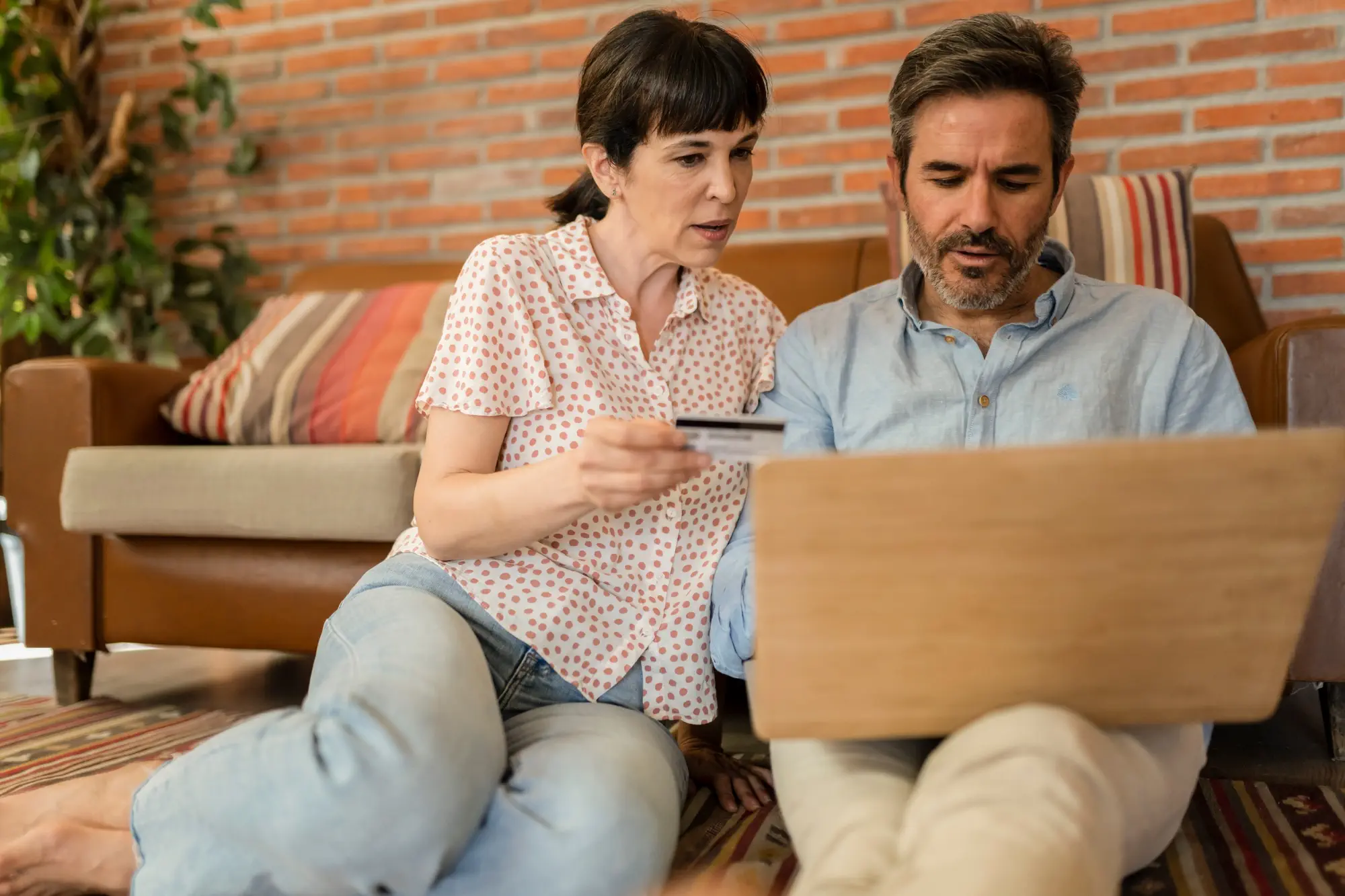 mature couple, family, Caucasian mature, adult and retiree using laptop with credit card,